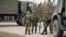 CRIMEA - Russian troops without identification marks near the blocked Ukrainian unit A-0883, Kerch, March 8, 2014