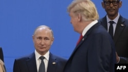 Архивное фото: Владимир Путин и Дональд Трамп во время саммита G20 в 2018 году